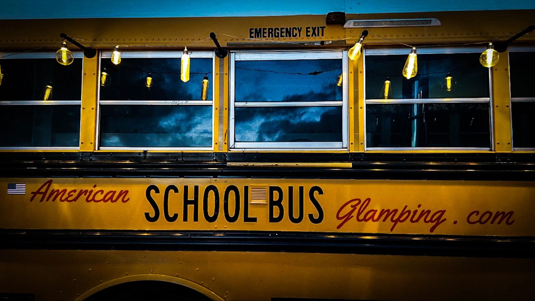The American school bus lit up at night